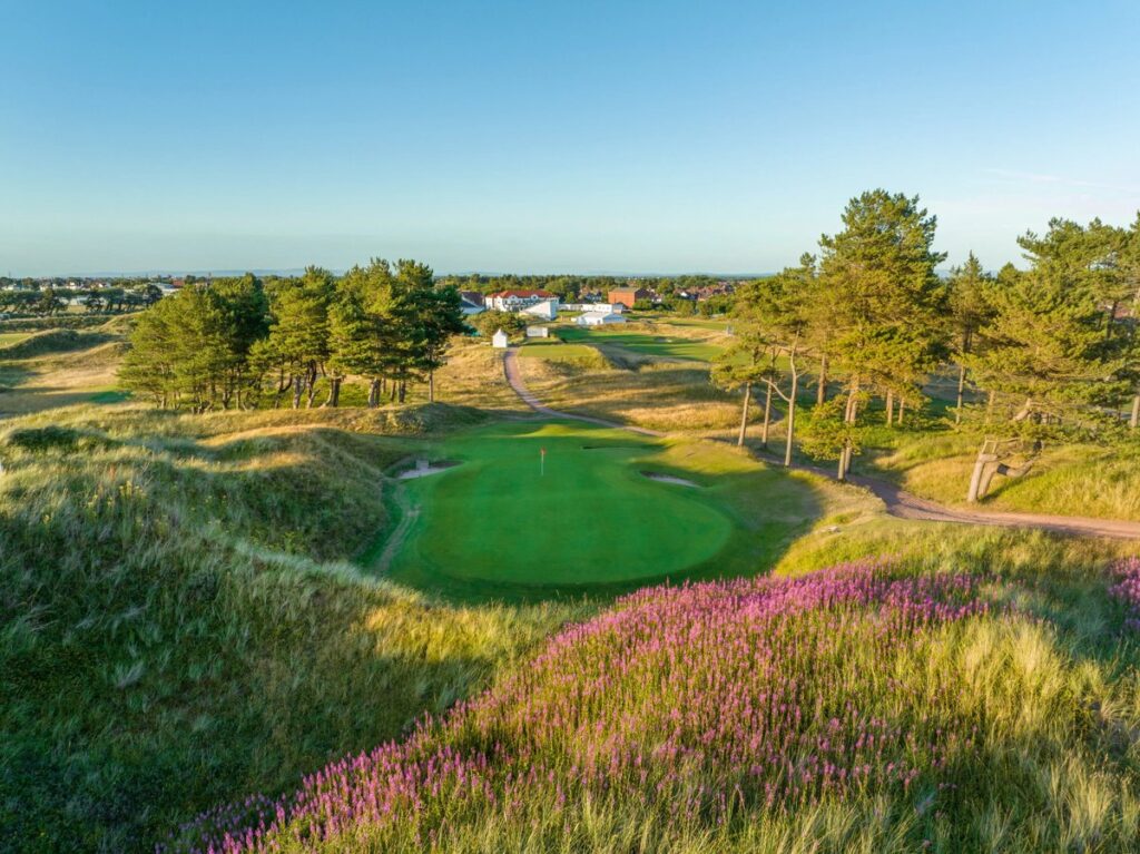 Hillside Golf Club green framed by dunes and pines