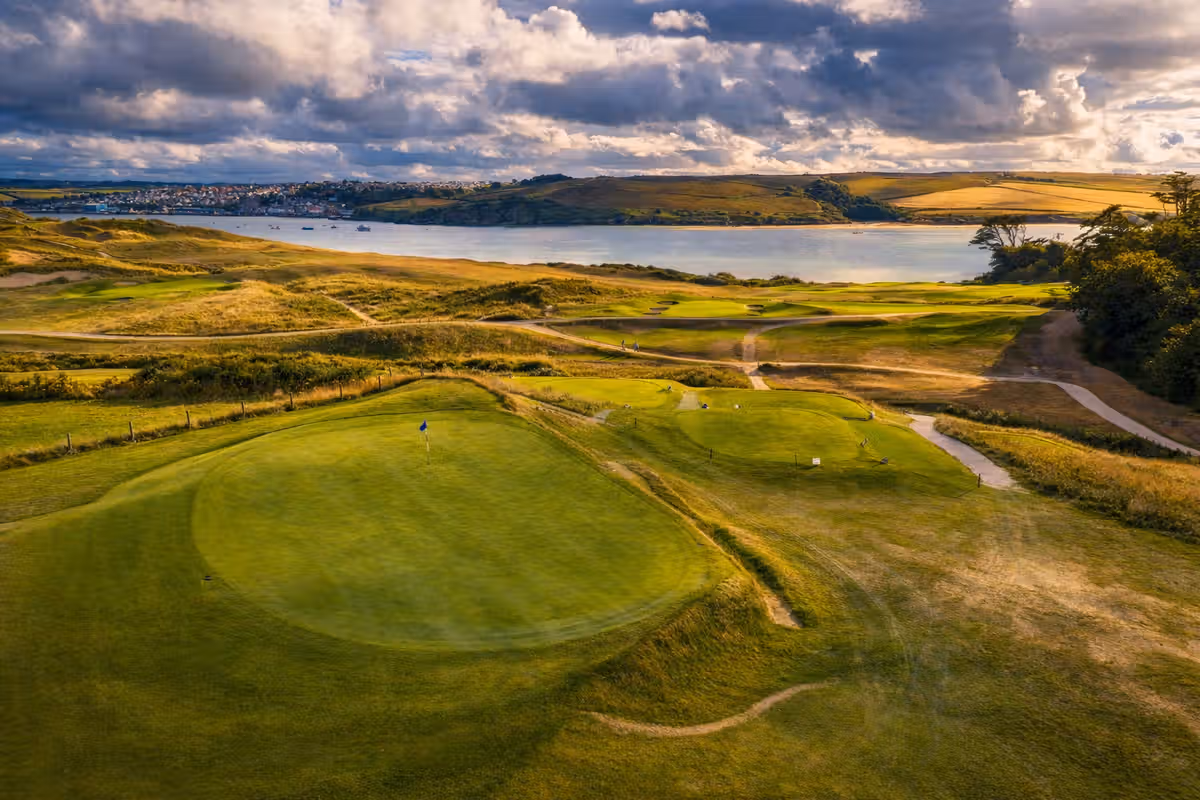 Aerial view of a green at St Enodoc Golf Club overlooking the Camel Estuary