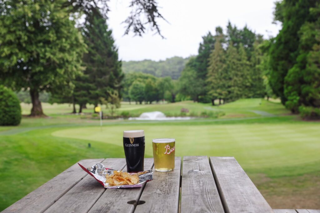 Drinks on the terrace overlooking the course at Donnington & Co